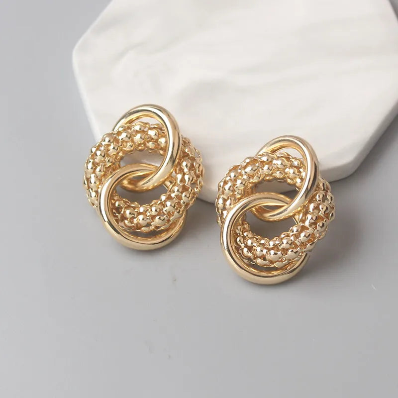 Stylish Twist Dangle Earrings – Bold & Elegant Gold Hoops for Women