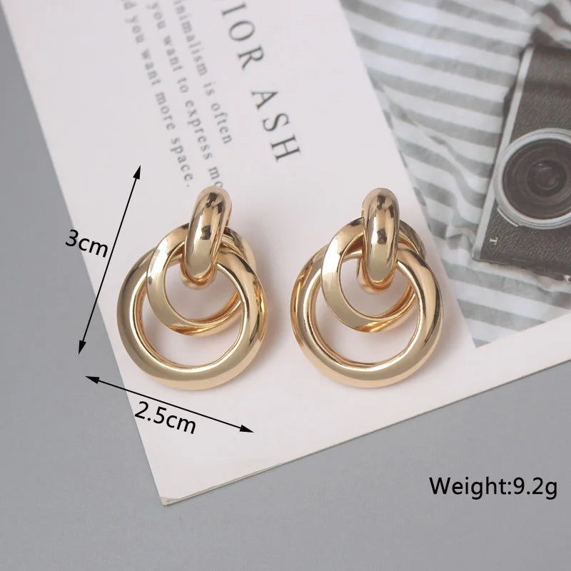 Stylish Twist Dangle Earrings – Bold & Elegant Gold Hoops for Women