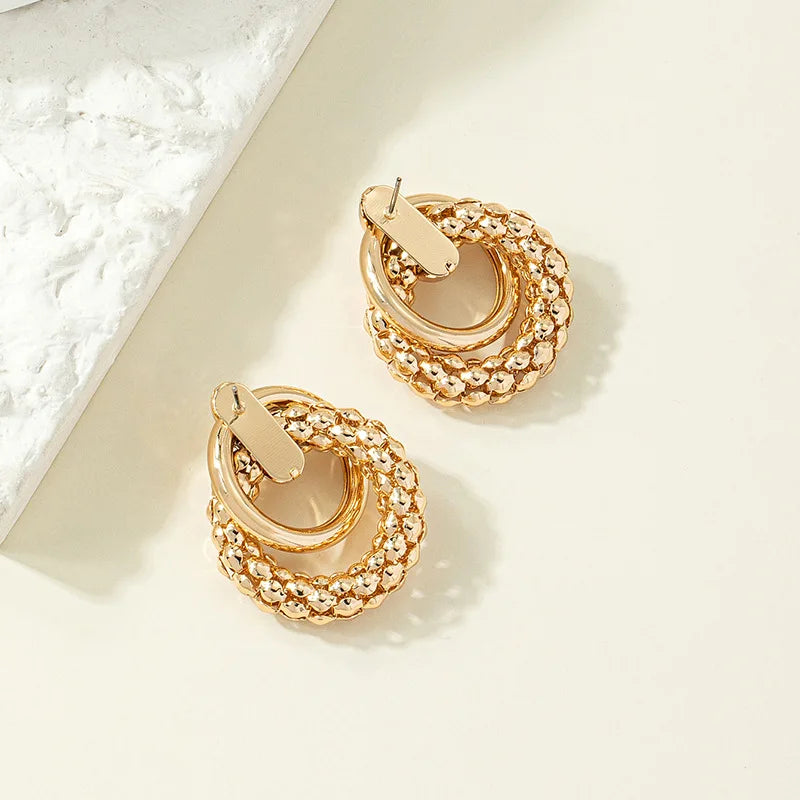Stylish Twist Dangle Earrings – Bold & Elegant Gold Hoops for Women