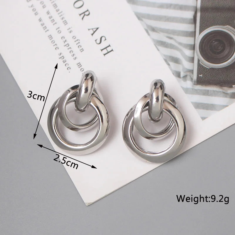 Stylish Twist Dangle Earrings – Bold & Elegant Gold Hoops for Women